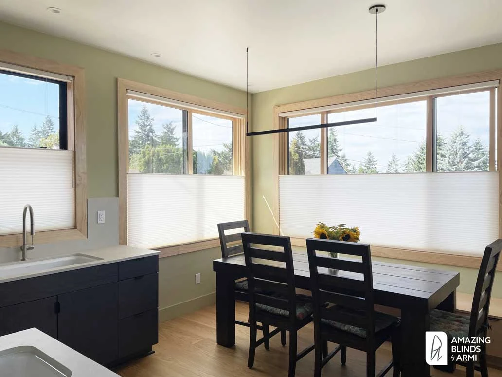 Dining room windows with Hunter Douglas shades.