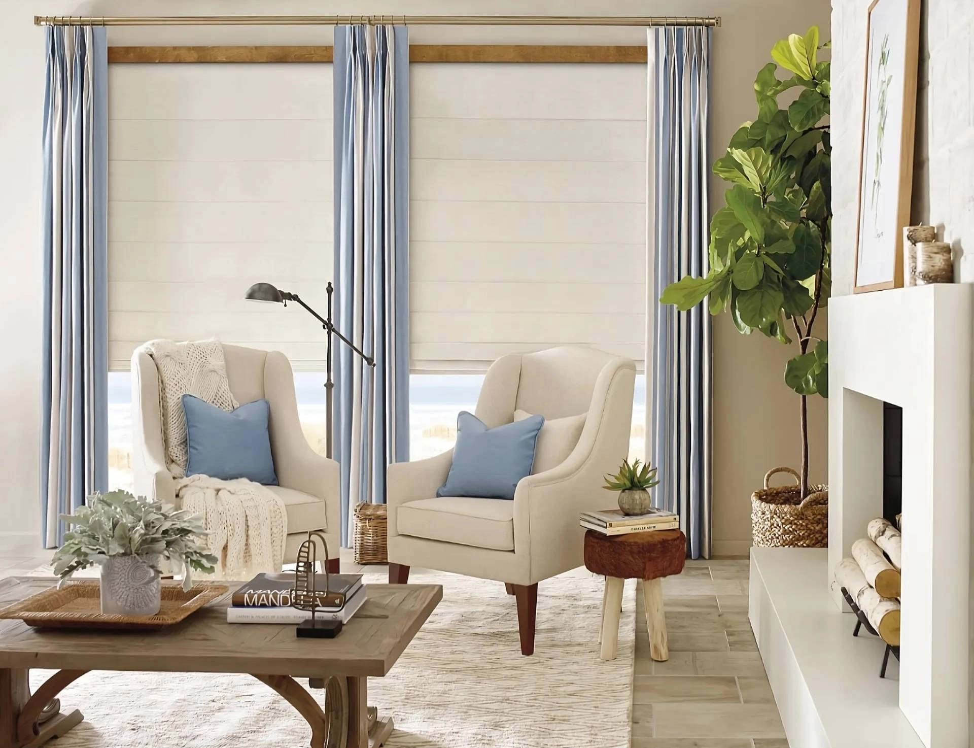 White Roman shades and blue drapery in a boho living room near Gresham, OR