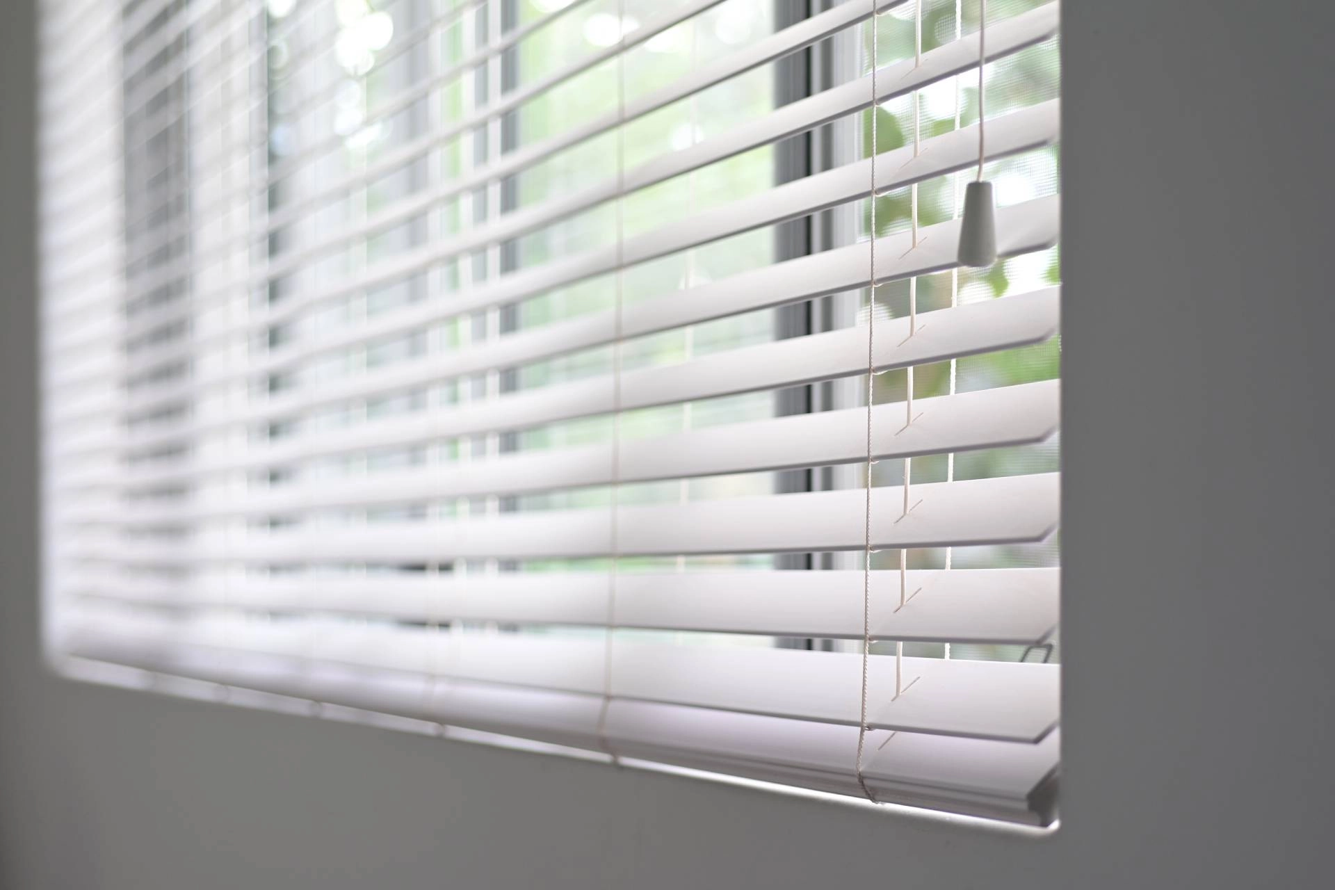 White custom blinds covering a window near Gresham, OR