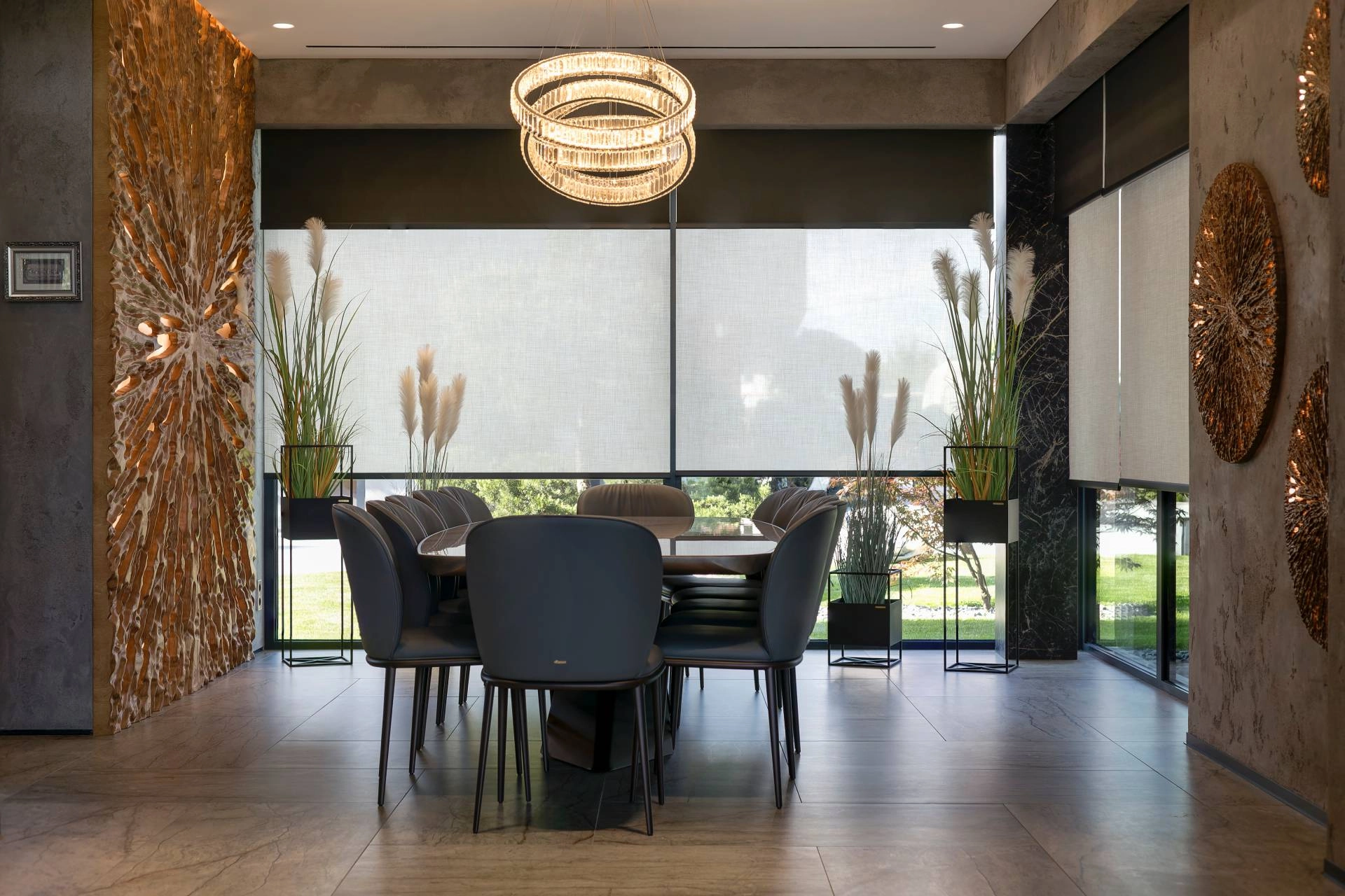 Modern dining room with shades on expansive windows featuring two opacity layers: room-darkening and blackout