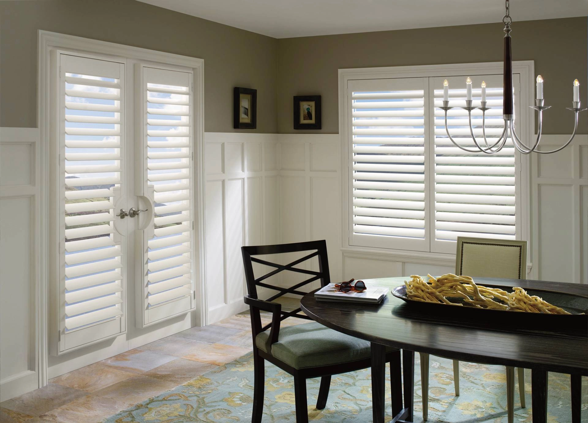 Hunter Douglas Palm Beach™ Polysatin™ Shutters in a modern dining room near Kailua-Kona, HI.
