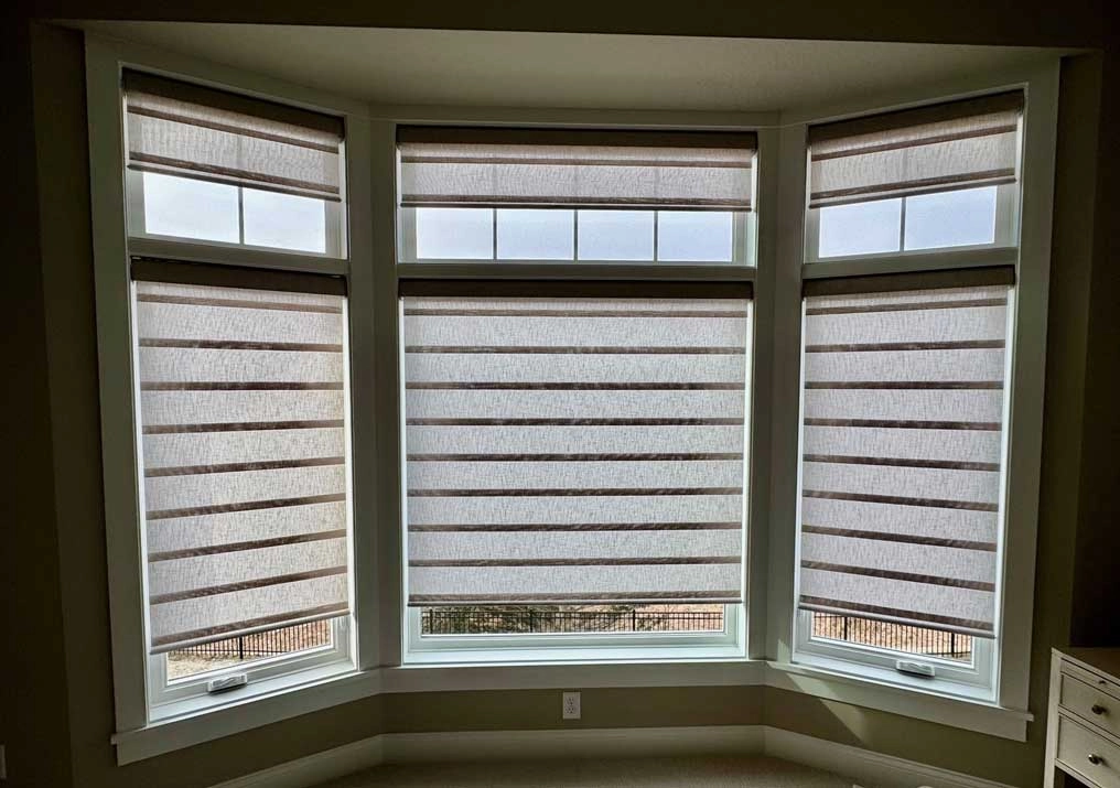 Bay windows with Hunter Douglas shades.