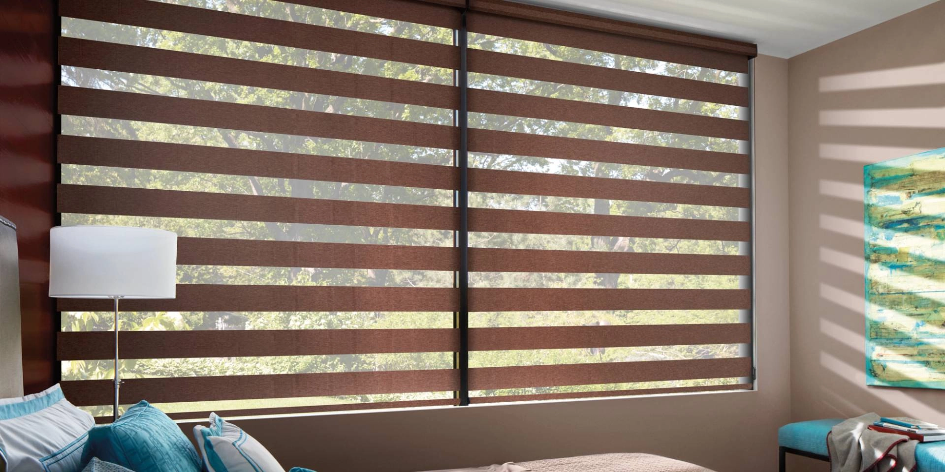 Hunter Douglas Designer Banded Shades, also called zebra blinds or shades, on a large bedroom window