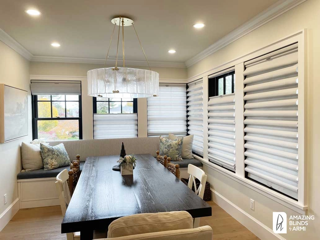 Dining room windows with Hunter Douglas Roman shades.