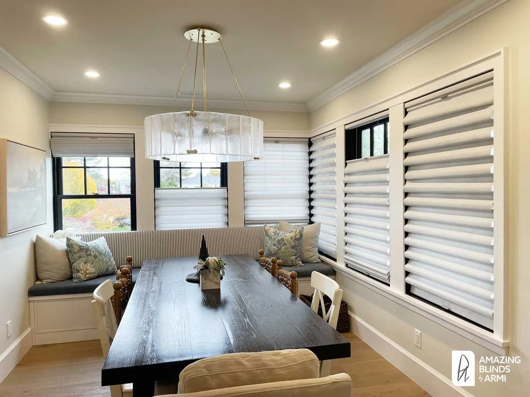 Dining room windows with Hunter Douglas Roman shades.