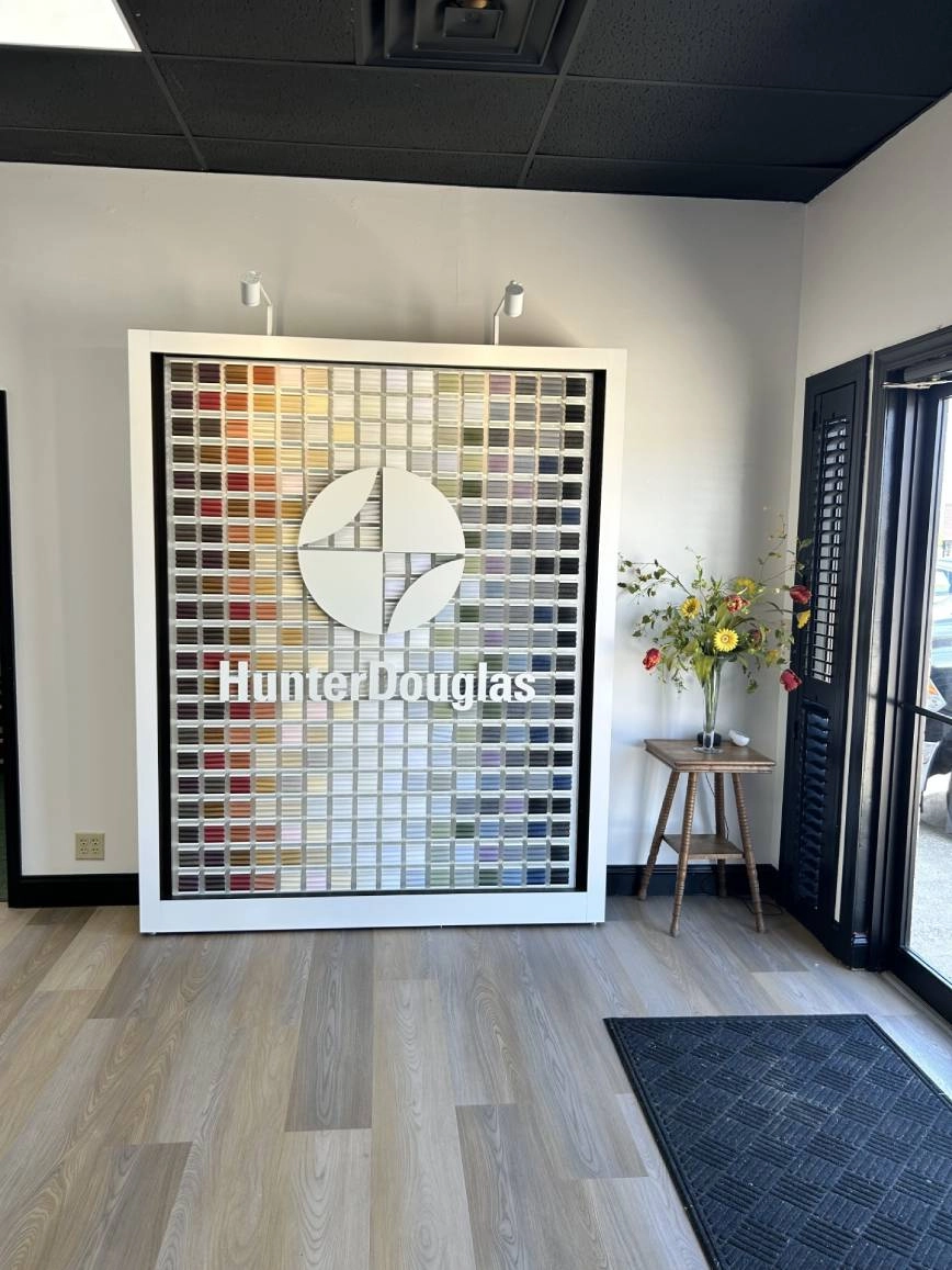 A Hunter Douglas window treatment display inside the House To A Home Interiors showroom