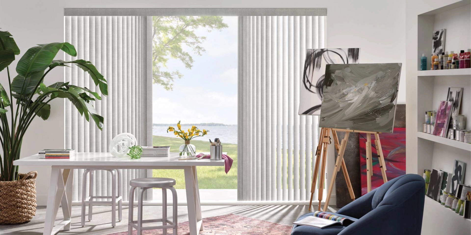 Vertical Hunter Douglas blinds on a sliding door, leading out to a backyard with grass and water near Honolulu, HI