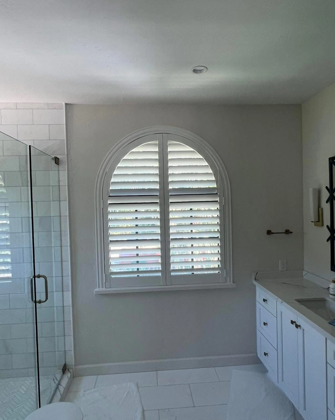 Shutters in a bathroom window.