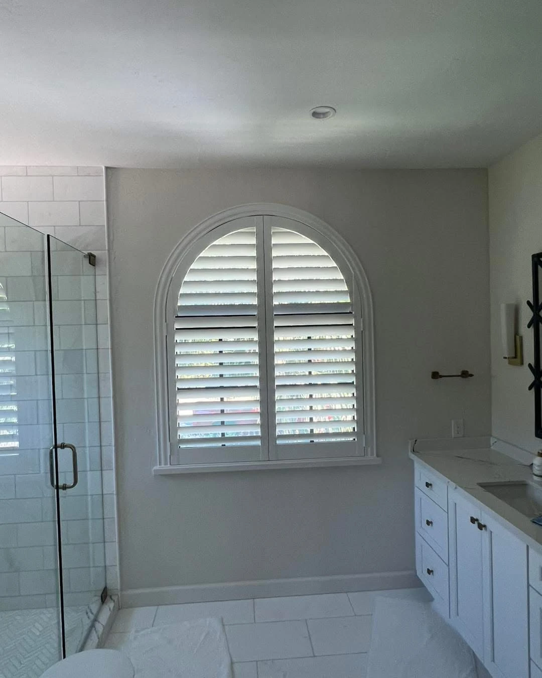 Shutters in a bathroom window.