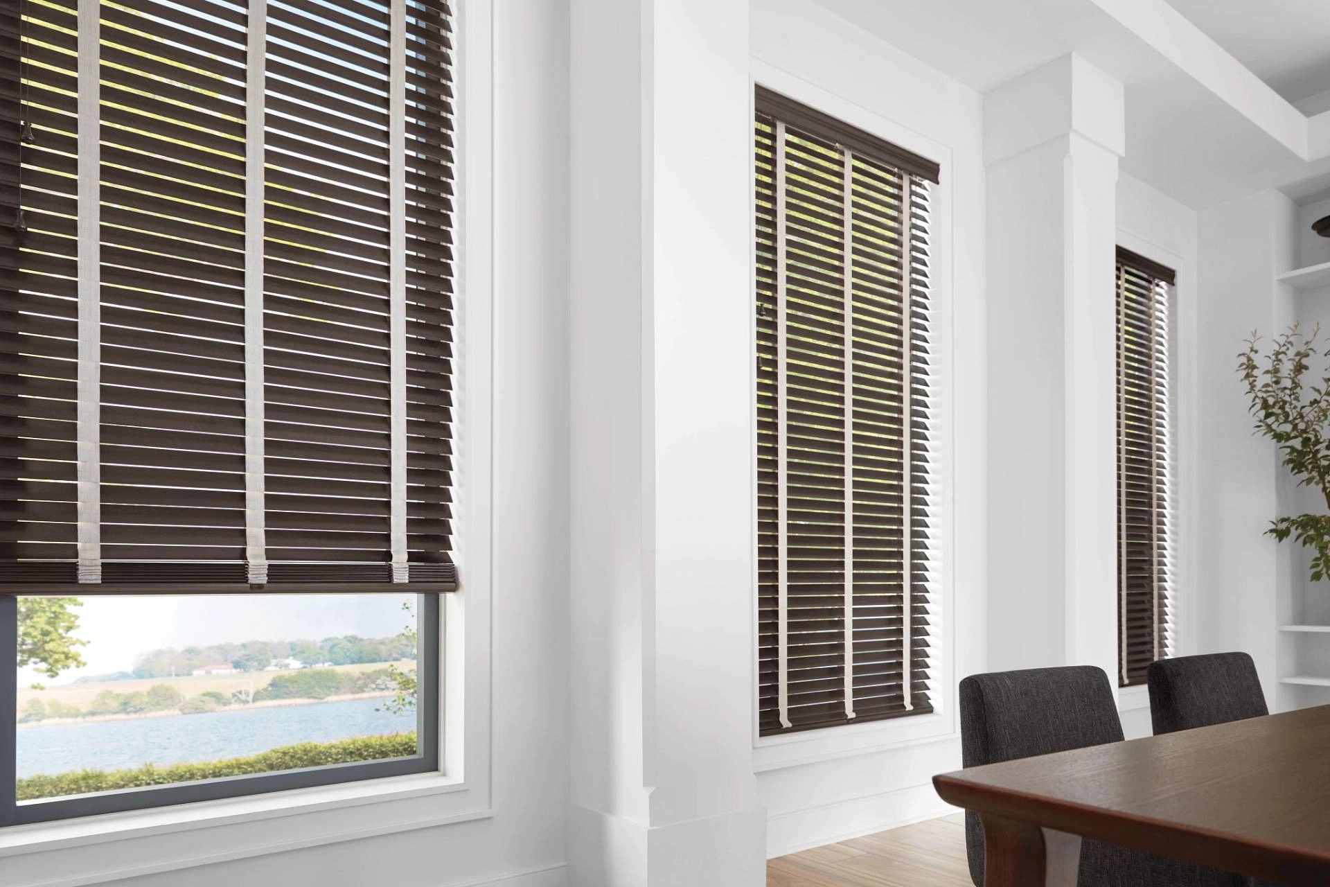 Hunter Douglas Parkland® Wood Blinds blocking light in a rustic living room near Rohnert Park, CA