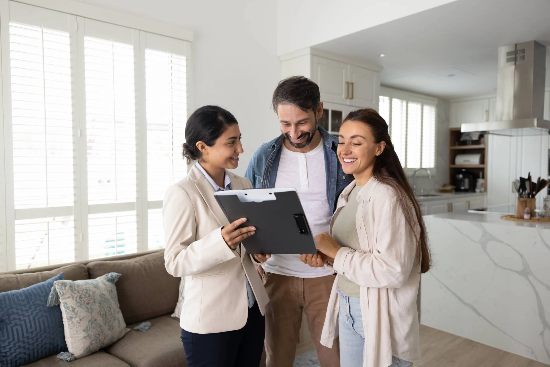 A couple discusses window treatment options during an in-home consultation near Oklahoma City, Oklahoma