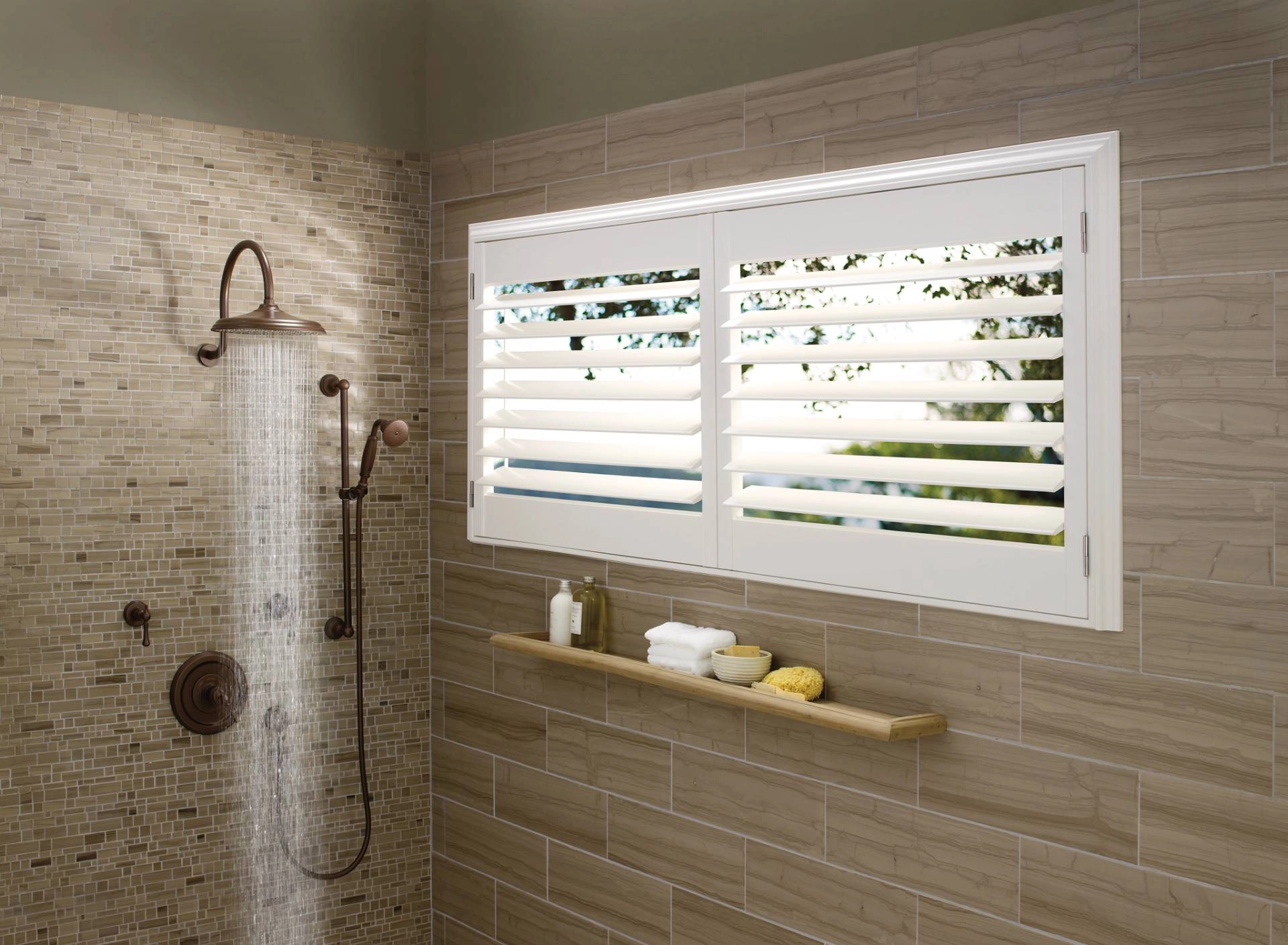Hunter Douglas Palm Beach™ Polysatin™ Vinyl Shutters covering a window in a shower.