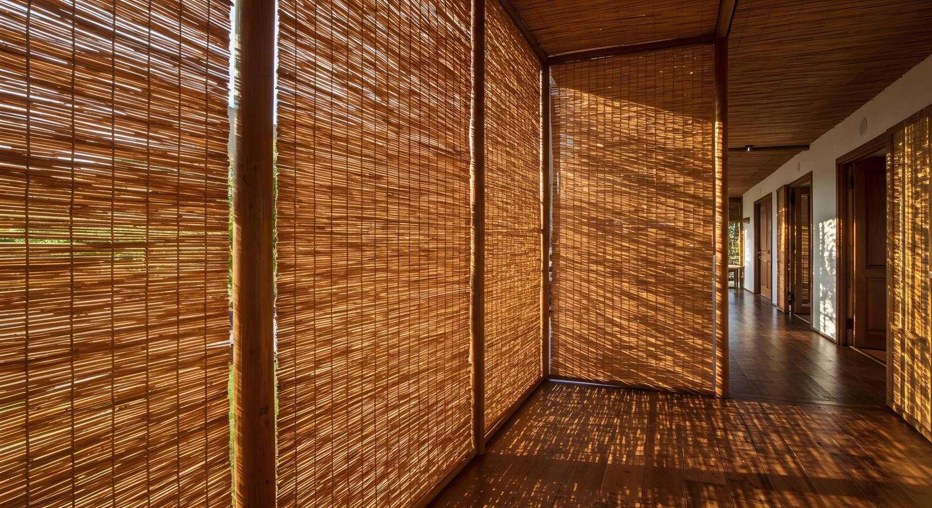 Four woven wood window shades on floor-to-ceiling windows at Mr. K’s Fabric Shop near Quincy, IL