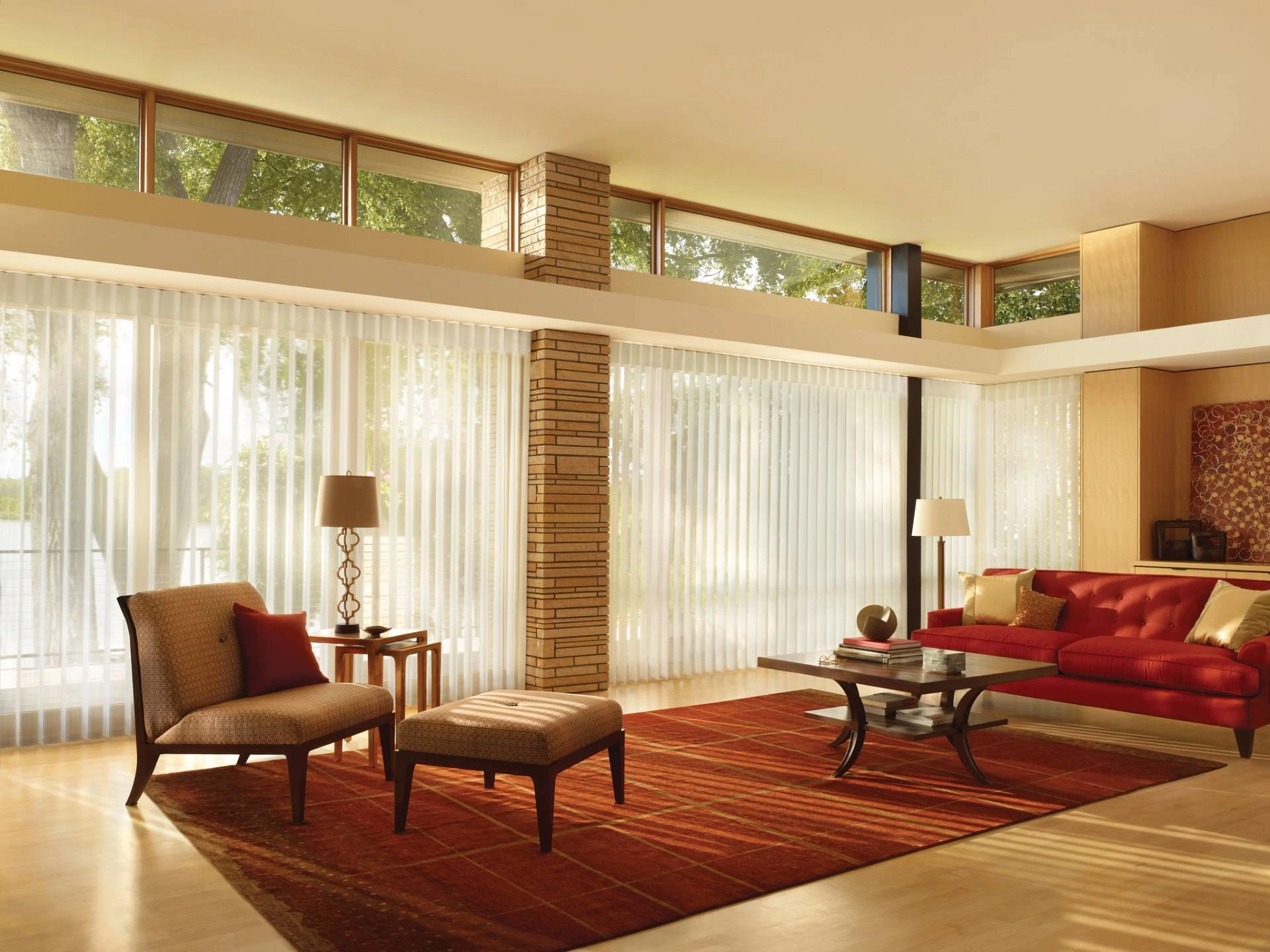 Hunter Douglas Luminette® Sheer Panels covering multiple large windows in a living room near Mobile, AL