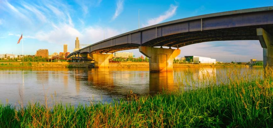 A landscape image of summer sun shining on a bridge near Council Bluffs, IA