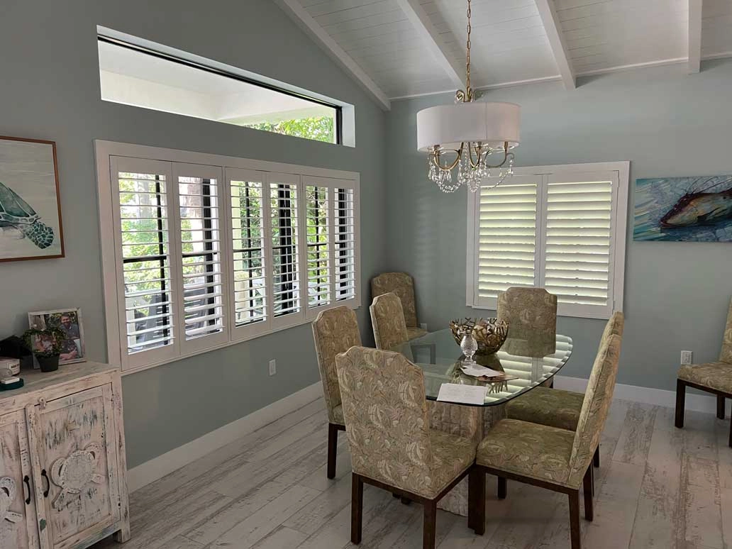 Blinds on dining room windows.