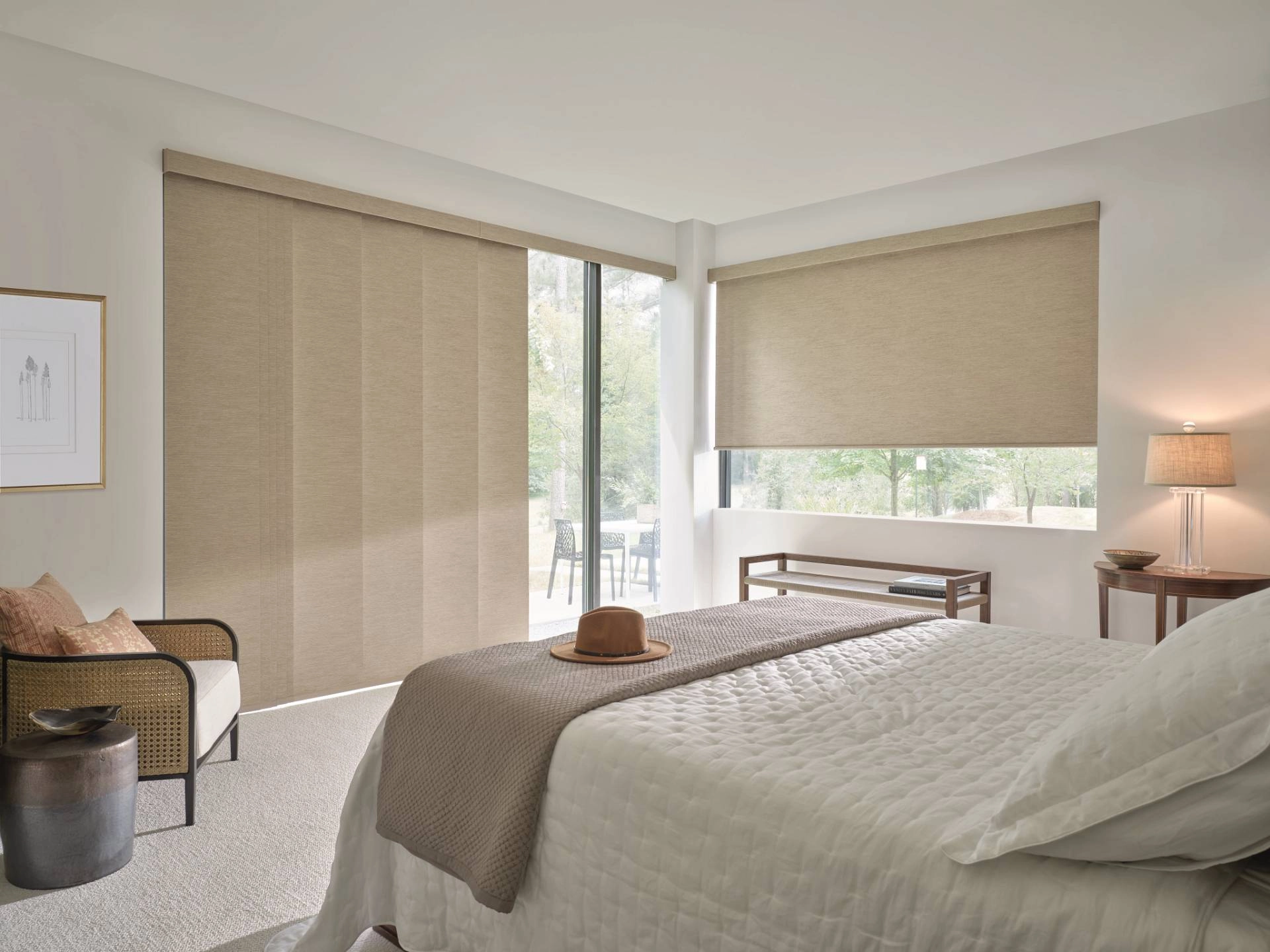 Hunter Douglas Designer Solar Shades covering windows in a bedroom.