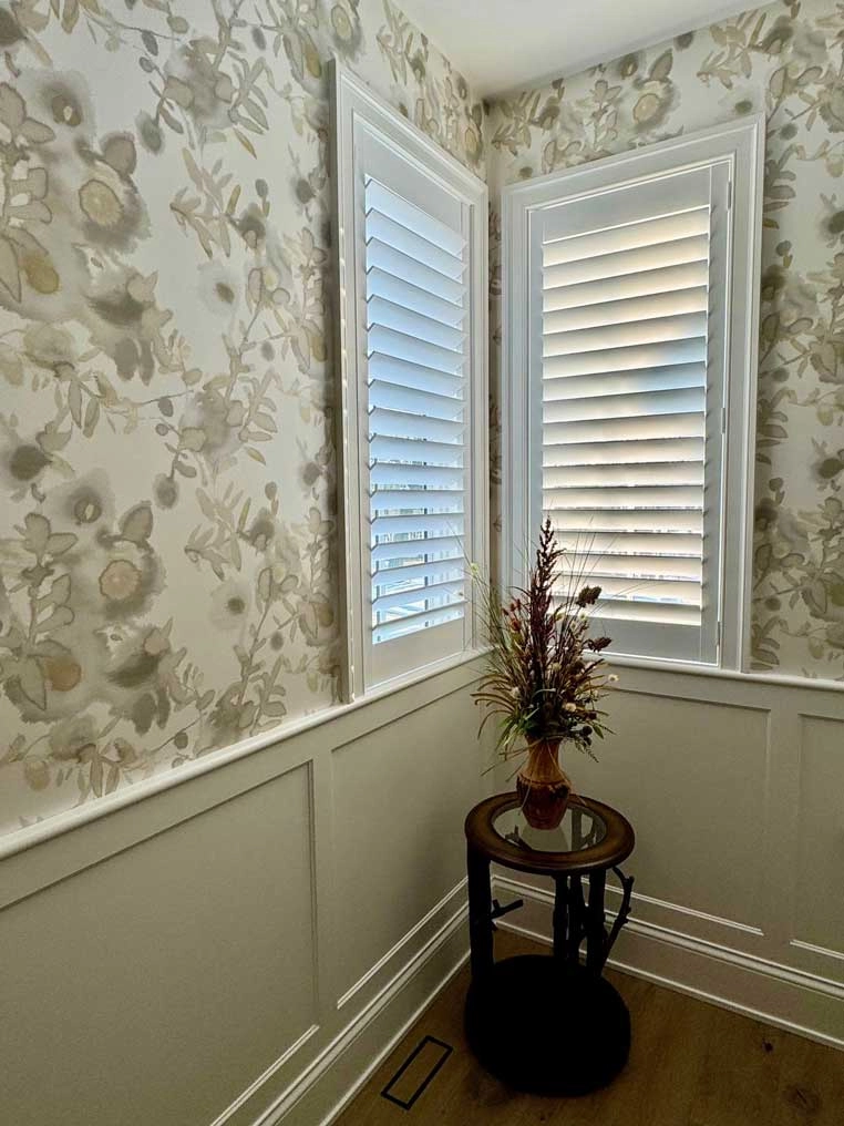 Hallway windows with shutters.