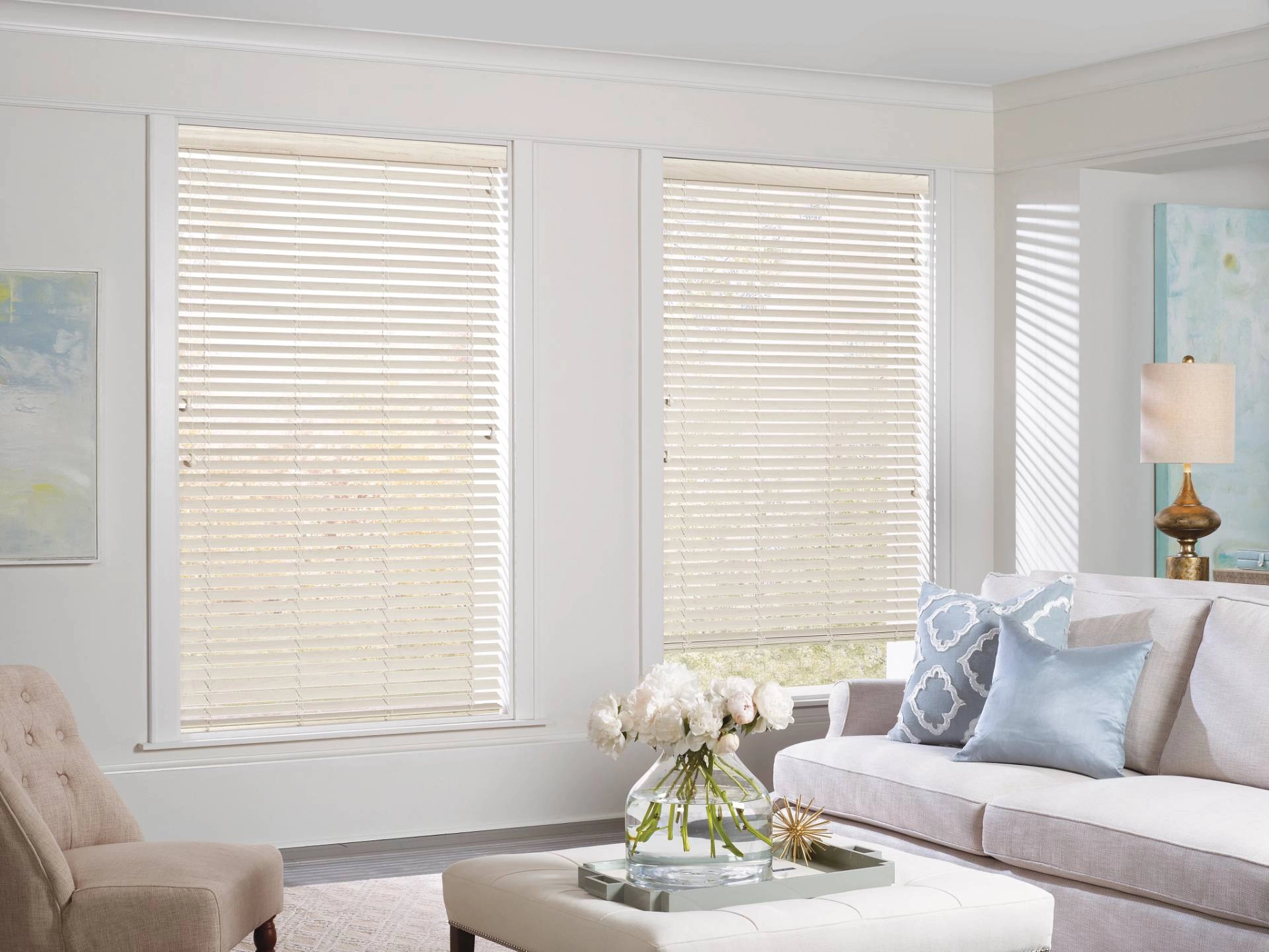Hunter Douglas wood blinds covering two windows in a living room near Traverse City, MI