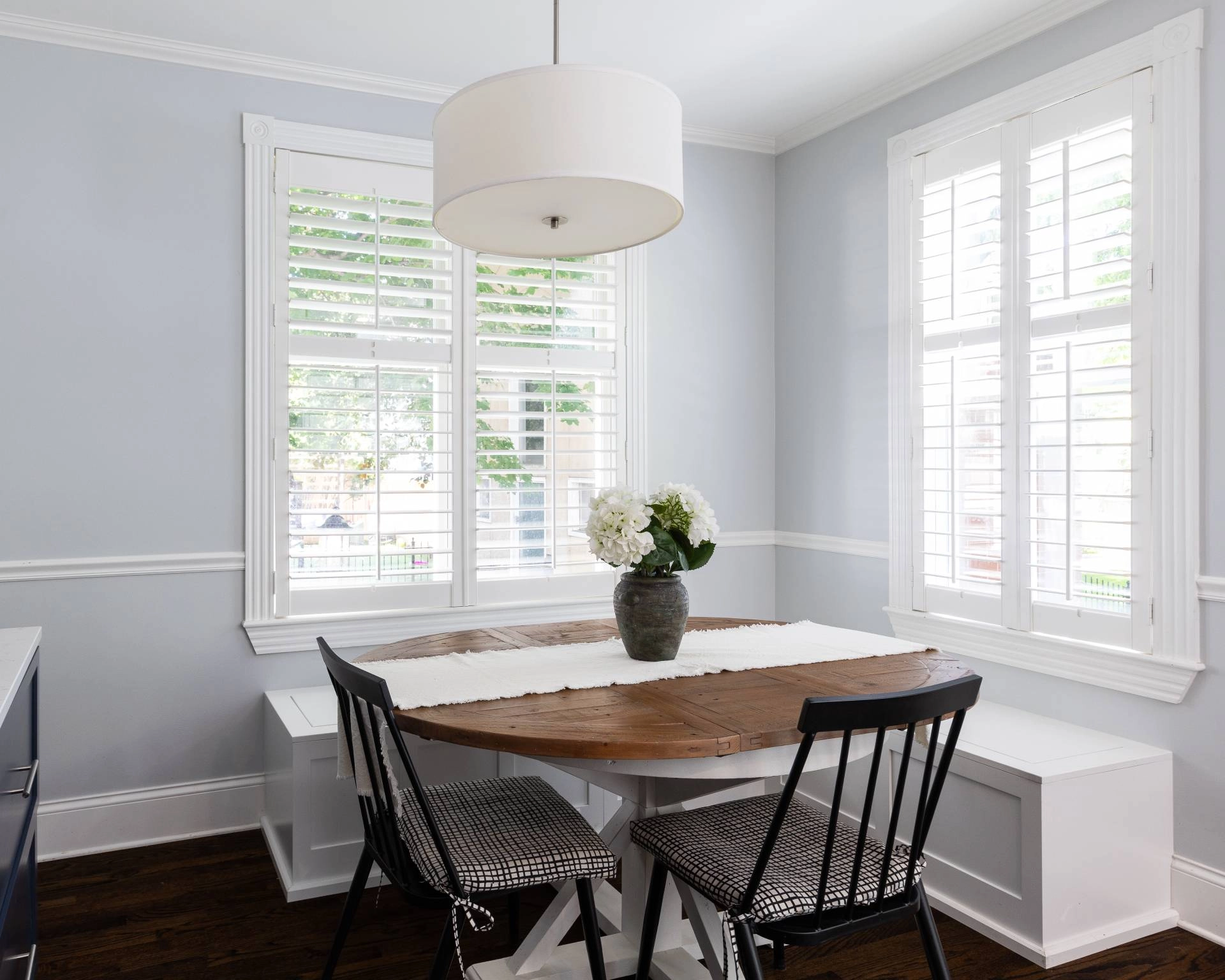 A modern farmhouse dining room with interior shutters near Mobile, Alabama (AL)