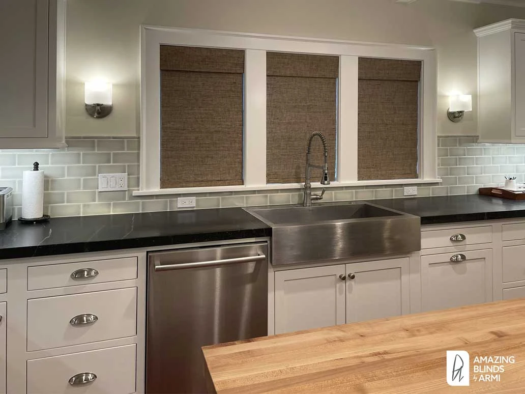 Kitchen windows with Hunter Douglas shades.