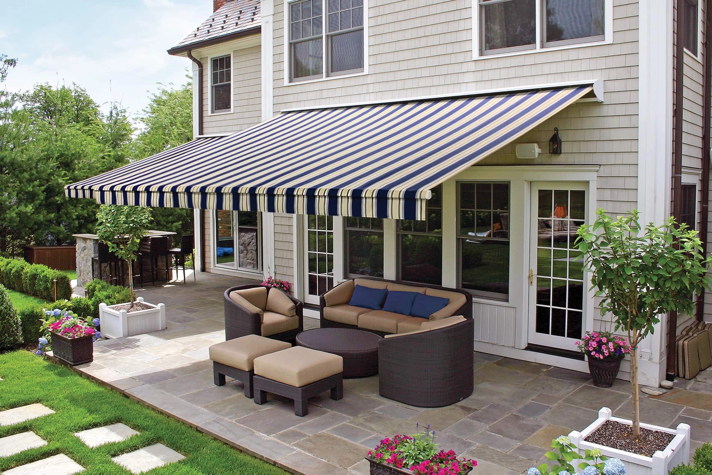 Outdoor shades, awnings, and enclosures by JM Windows.