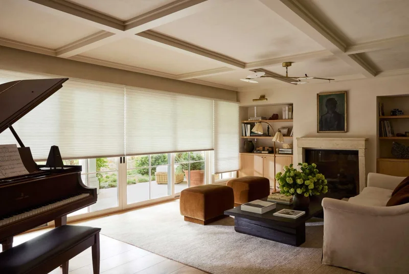 Living room with large windows and Hunter Douglas shades