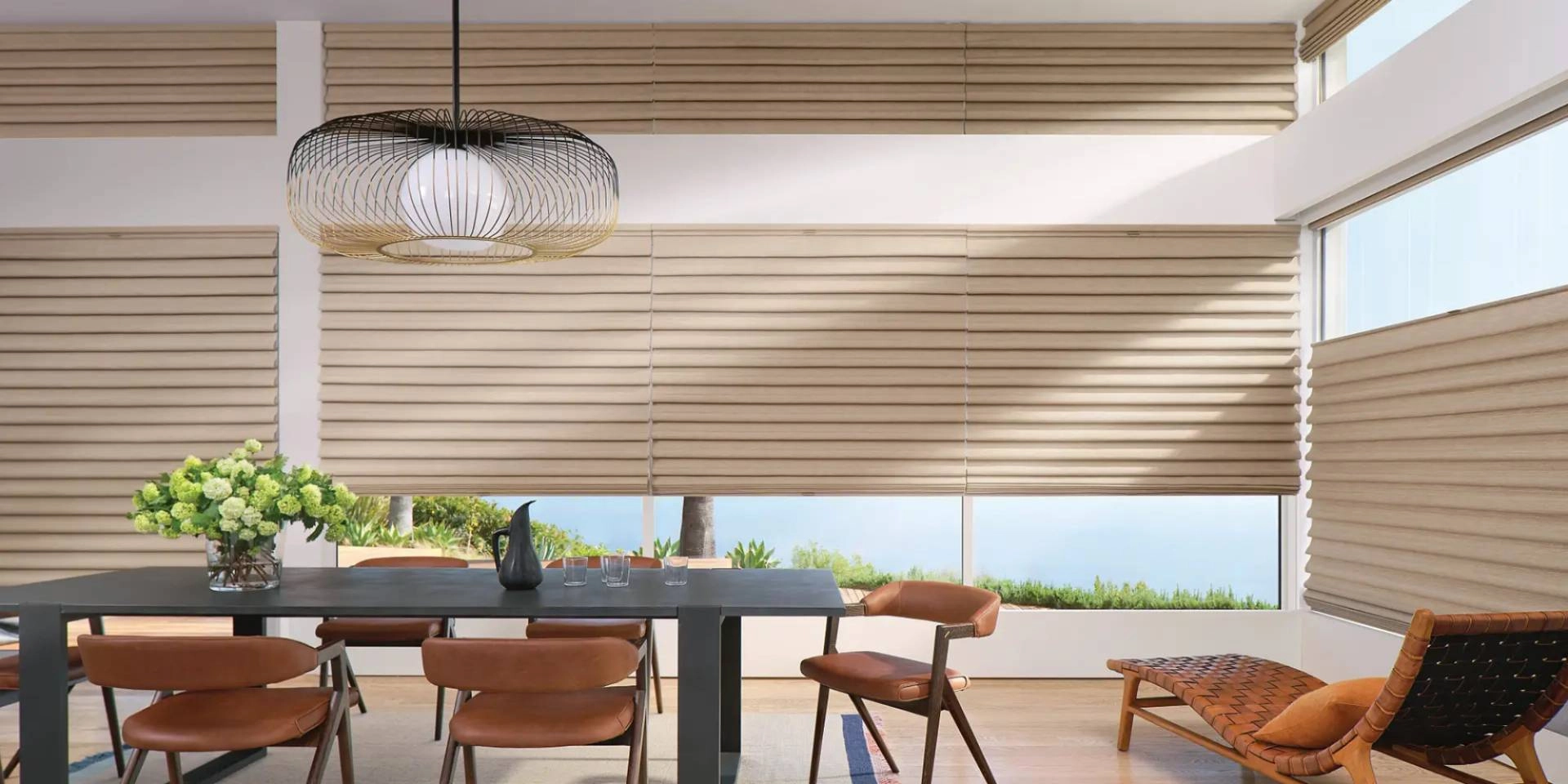 Lavish Hunter Douglas Roman Shades, a style of window treatment, on large living room windows