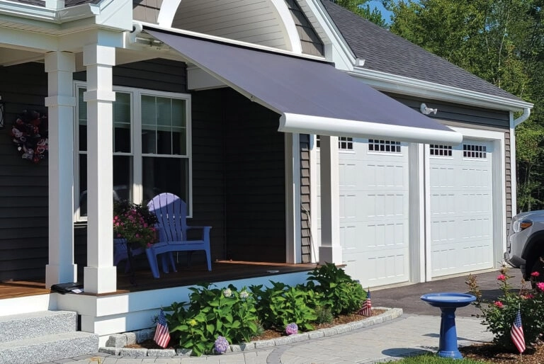 Outdoor shades, awnings, and enclosures by JM Windows.