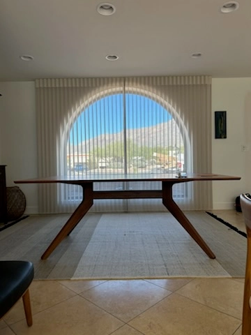 Vertical window covering on arch window