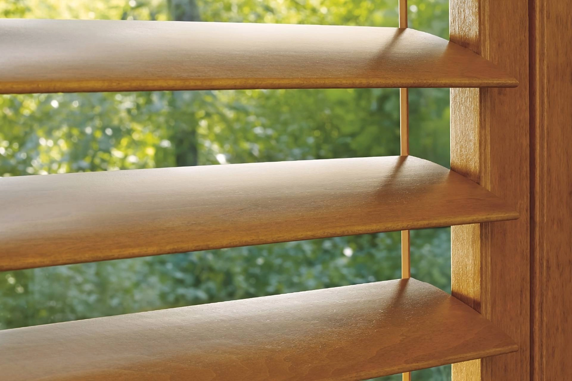 Up-close image of custom window shutters from Hunter Douglas, partially opened, on a home's window