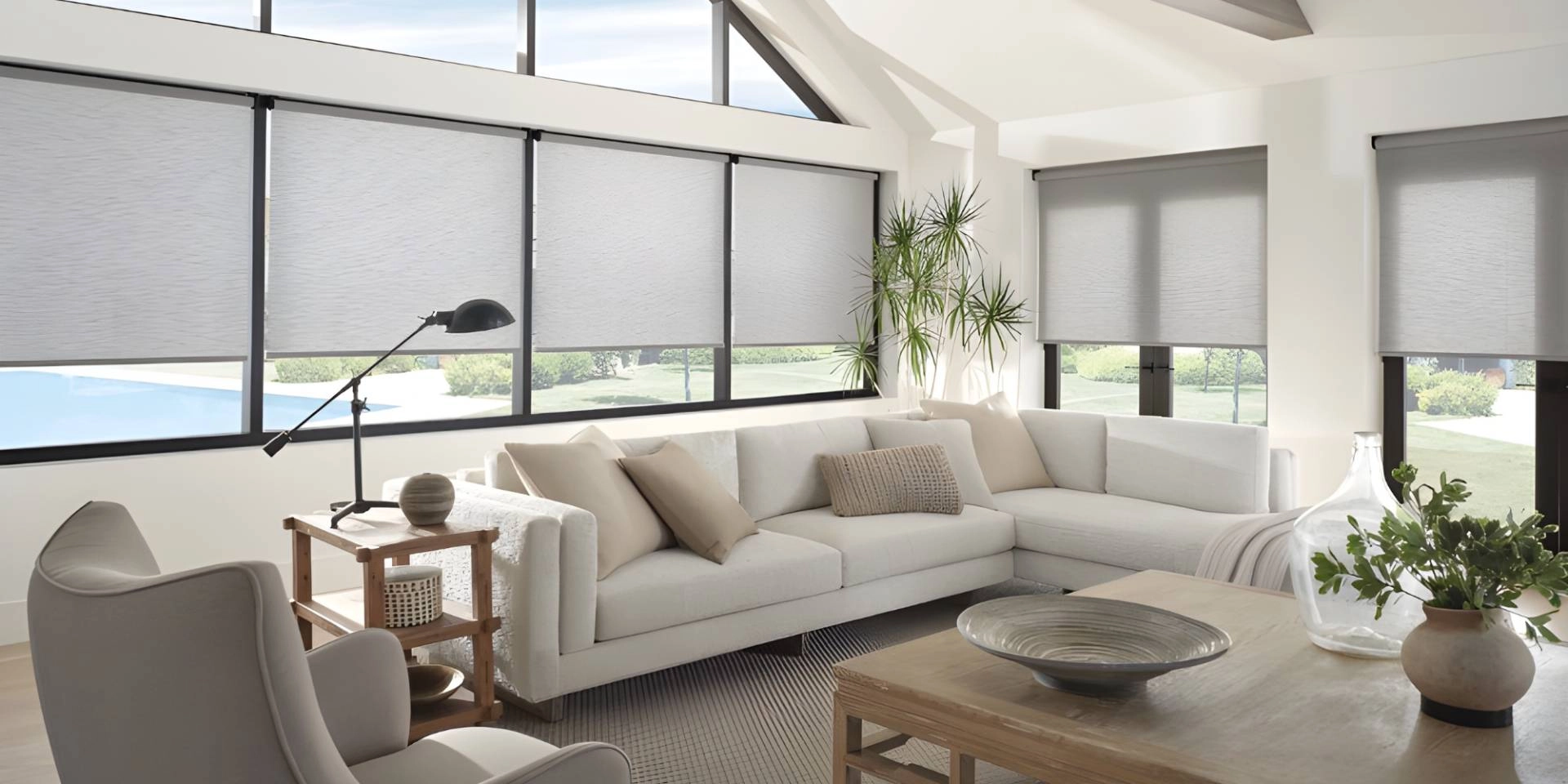 Hunter Douglas Designer Roller Shades on large windows, creating a minimalist aesthetic in a living room