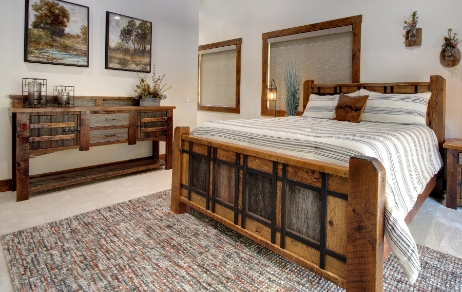 A bedroom with windows featuring Hunter Douglas shades.