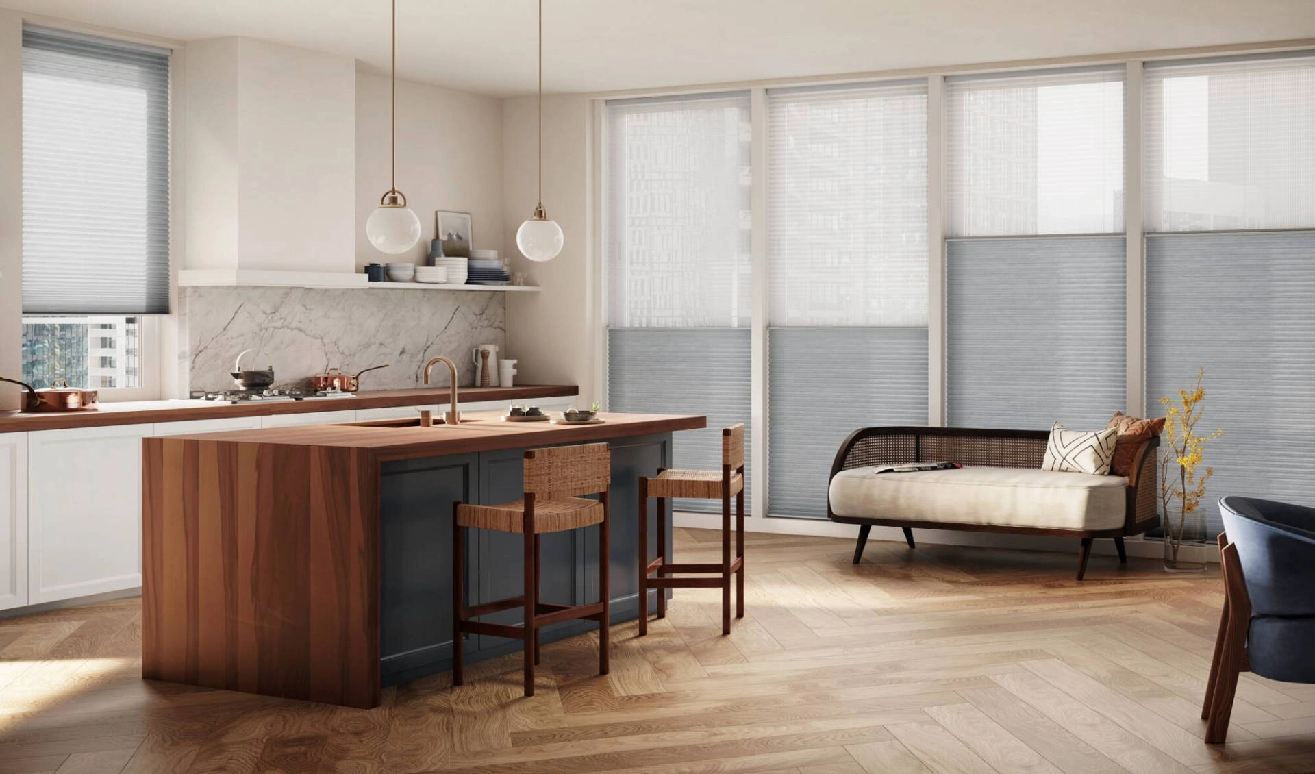 Applause® Cellular Shades in a bright open-plan kitchen and living space.