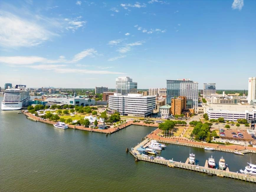 Image featuring buildings and companies in part of the Norfolk, VA, area, near the Waterside District
