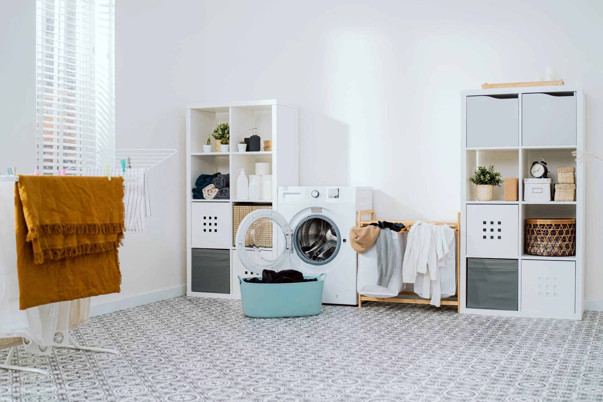 Modern laundry room with custom shutters, washer, and shelving units near Seneca and Greenville, SC.