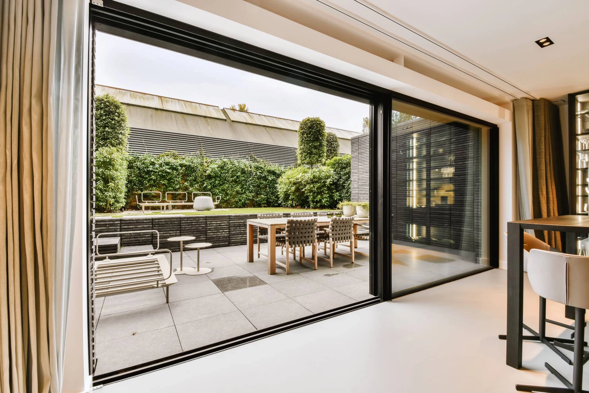 A large sliding glass door, overlooking a lovely patio, in need of more practical treatments near Fairfax, VA