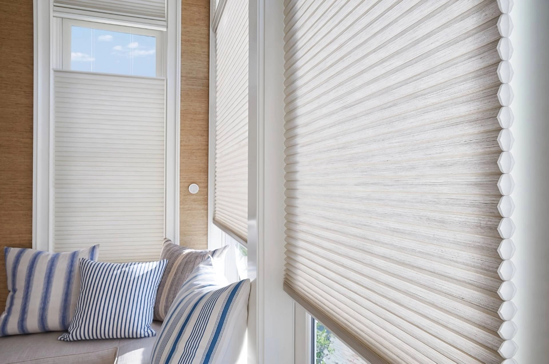 Hunter Douglas Duette® Cellular Shades on windows in a bright and airy living room