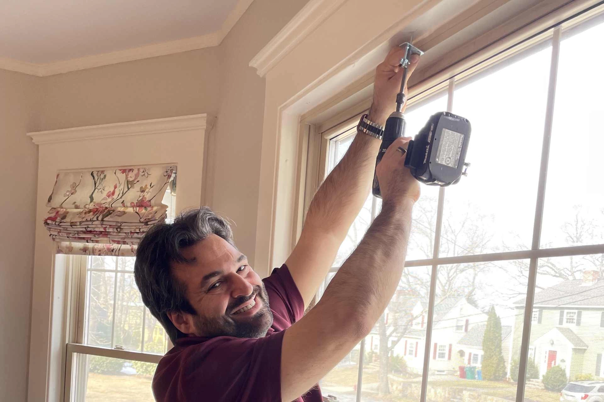 photo: 10041615-banner-custom-hunter-douglas-window-treatments-being-installed.jpg