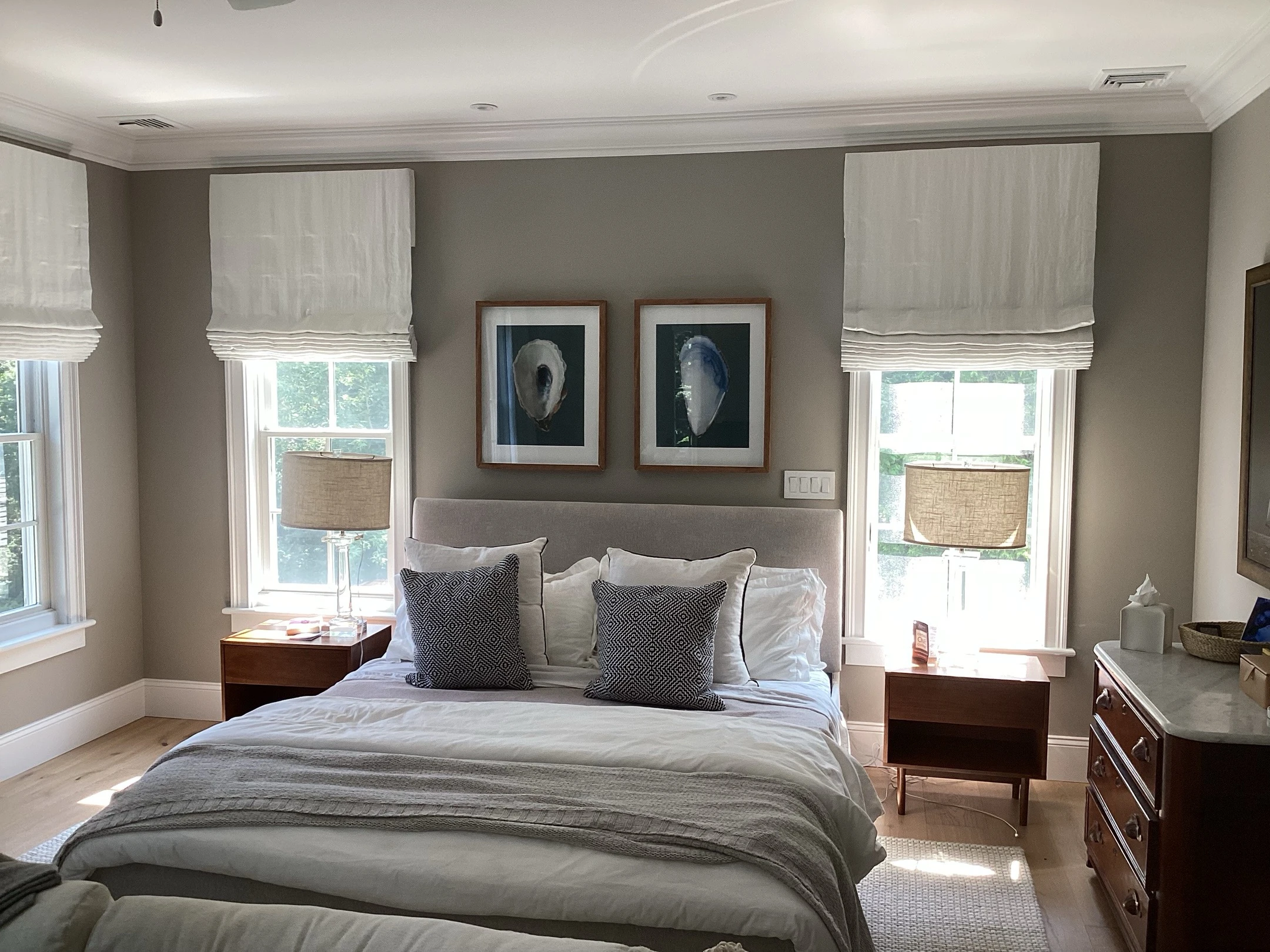 Bedroom windows with shades.