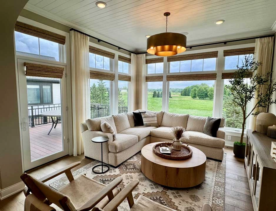 Living room windows with Hunter Douglas shades.