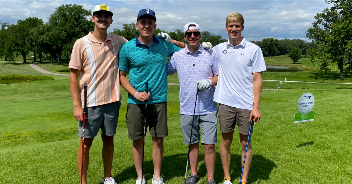 The AdShark team plays in the Legacy Children's Foundation's Golf Tournament.