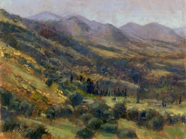 plein air painting of rolling hillside with mountains in the background