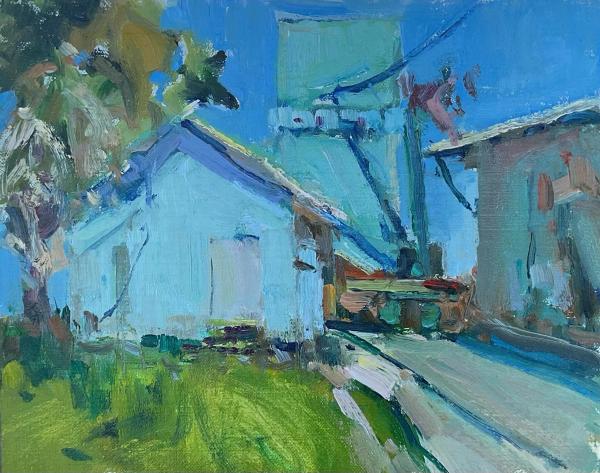 plein air painting of bright blue building with palm tree on sunny street
