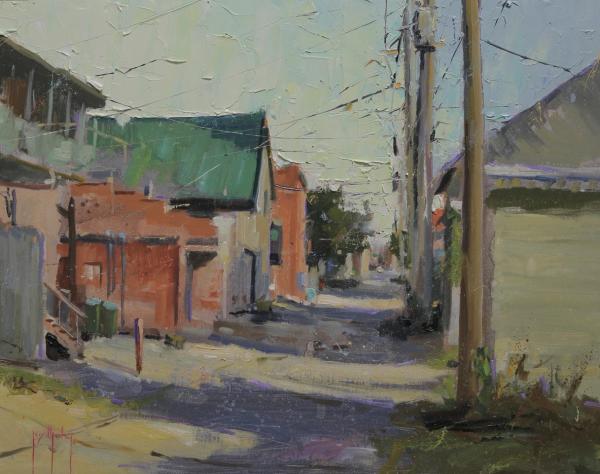 plein air painting of alley with brick buildings, utility poles, mountains