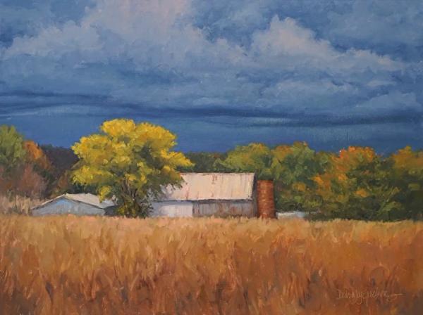 plein air painting of autumn farm buildings under a stormy sky