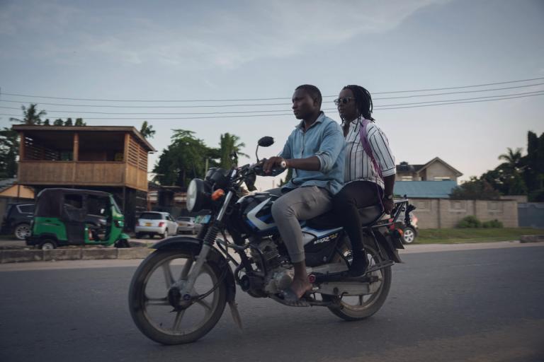 Two people on a motor cycle