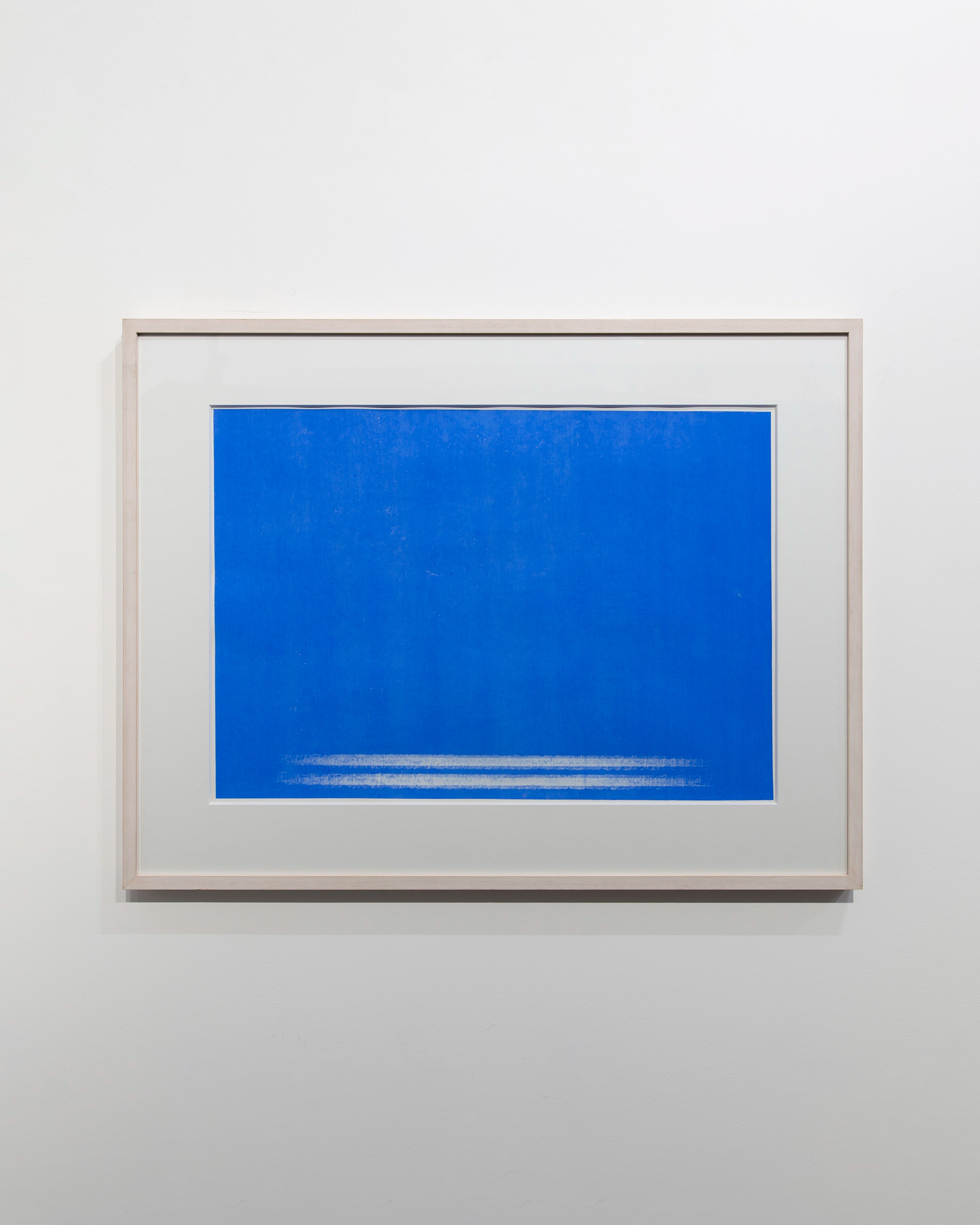 Vibrant blue rectangle with a thin horizontal line of lighter blue across the lower portion, mounted on white rag paper in a light wooden frame