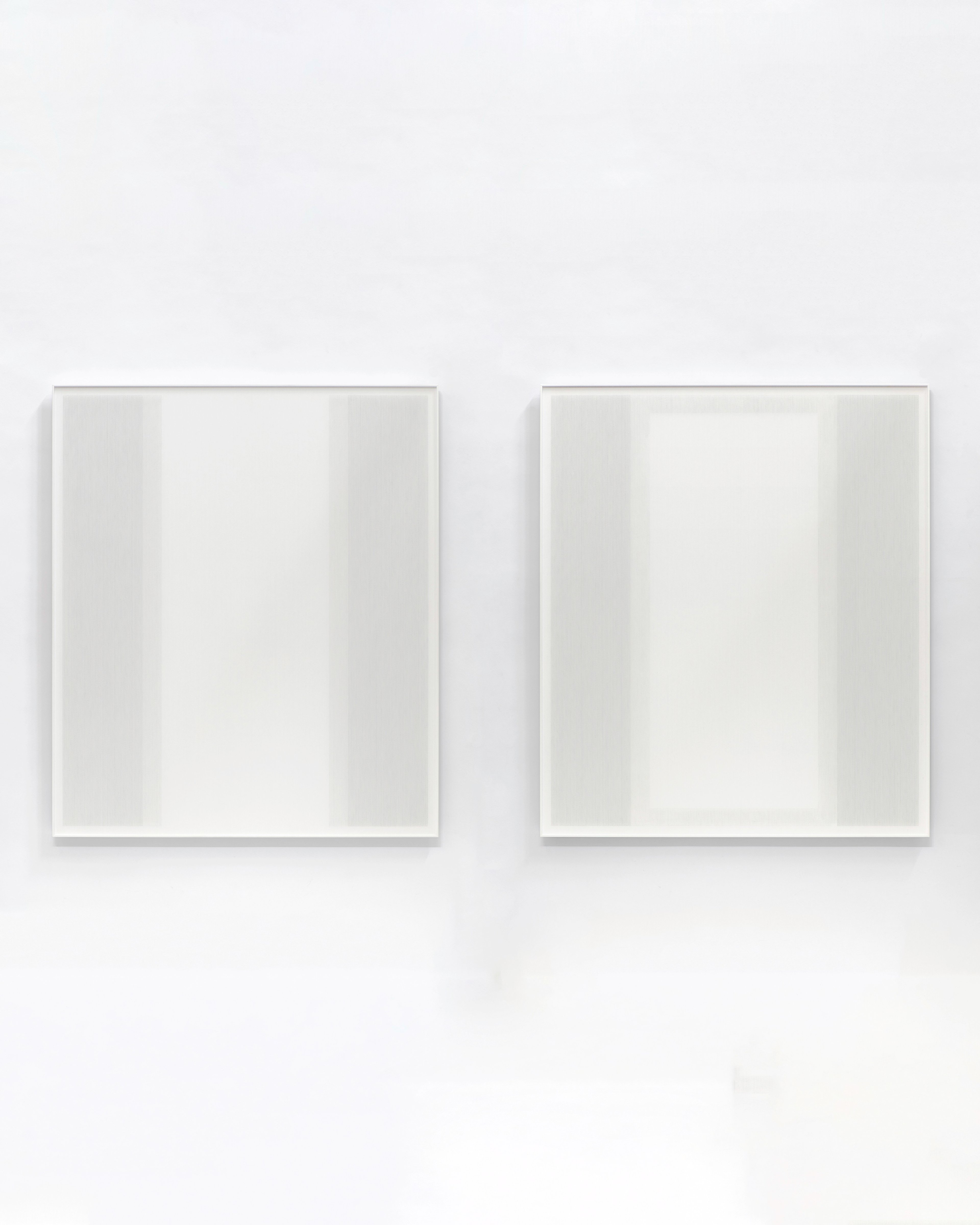 Two square framed panels with subtle vertical striations in pale grey and white thread, acrylic, and mixed media on aluminium composite, hung side by side ag…