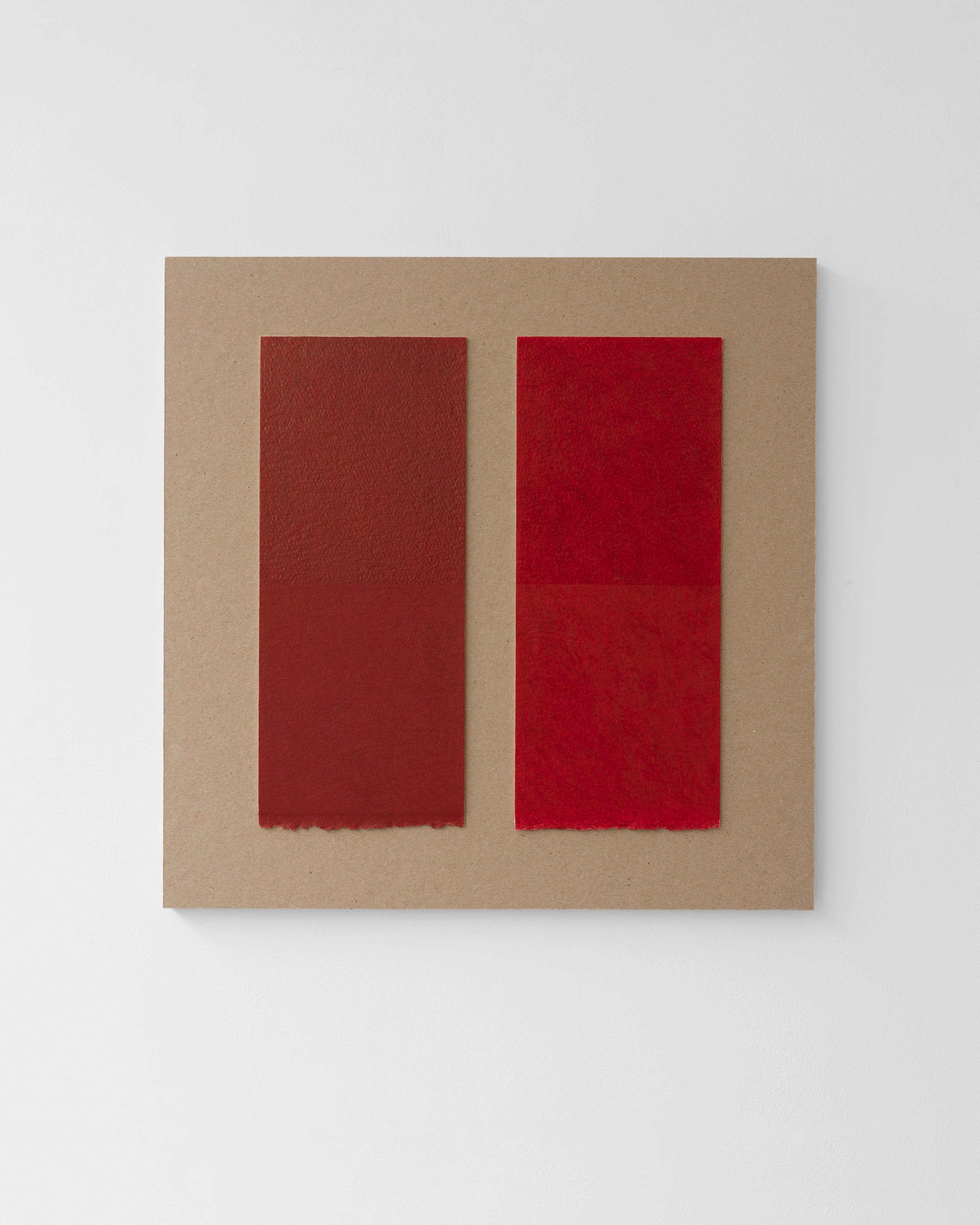 Two vertical rectangles in deep burgundy and bright red wax pencil on kraft card mounted on birch plywood, with soft edges suggesting layered materials and c…
